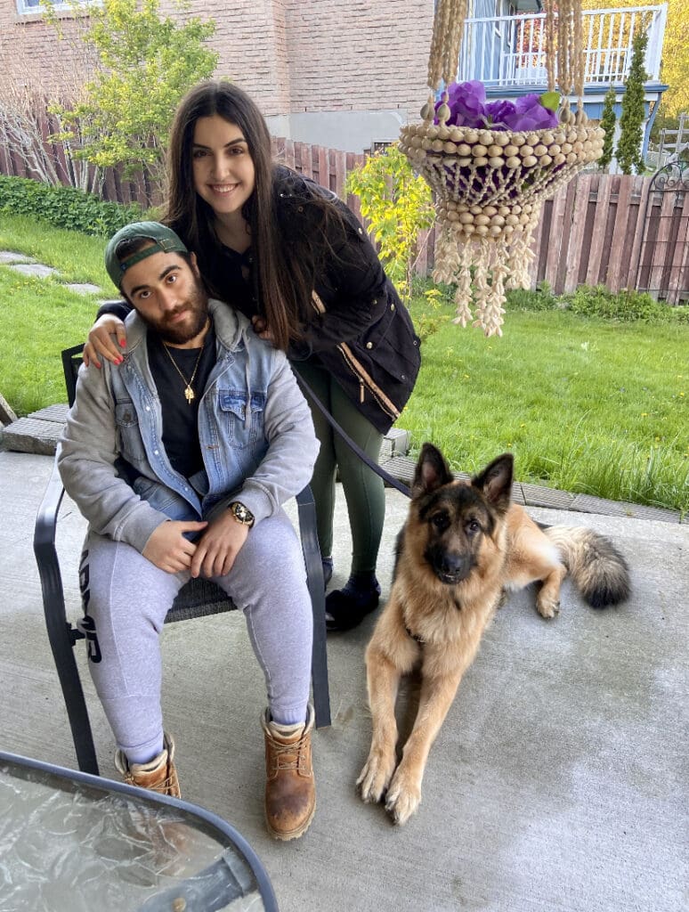 Bride and groom posing outdoors at their wedding